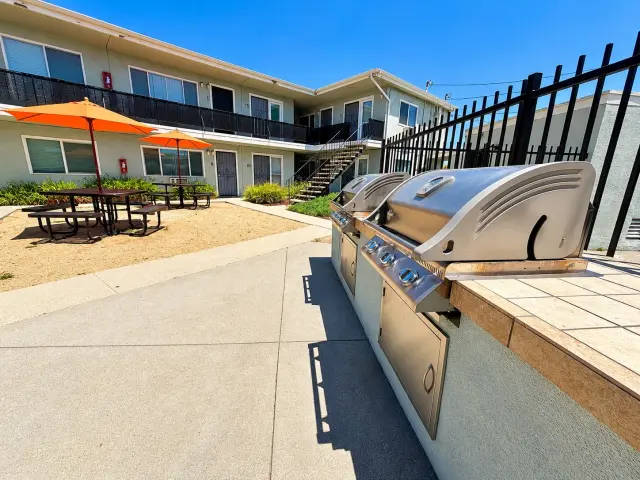 Built-in barbecue grills next to the courtyard picnic area
