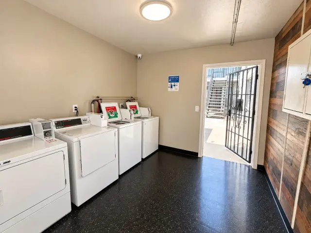 Laundry room with washers and dryers