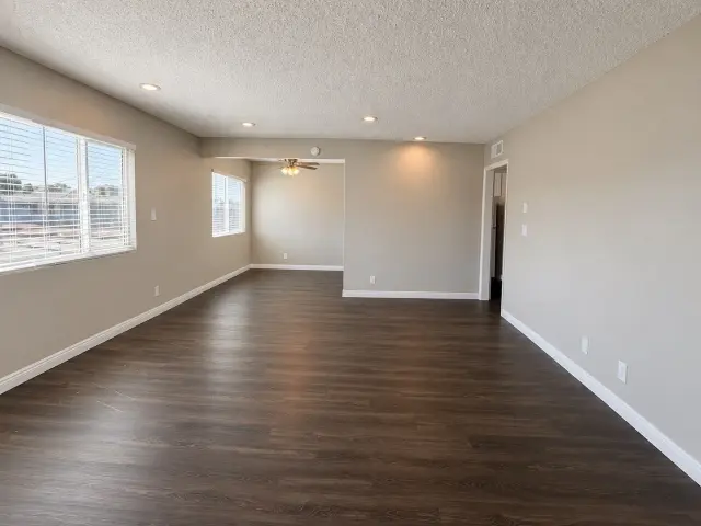 Spacious living room with wood-style flooring